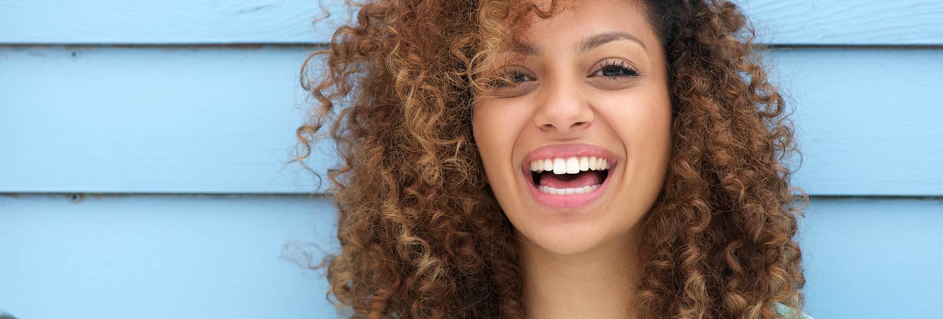 Beautiful woman smiling after Tooth Fillings and Bonding